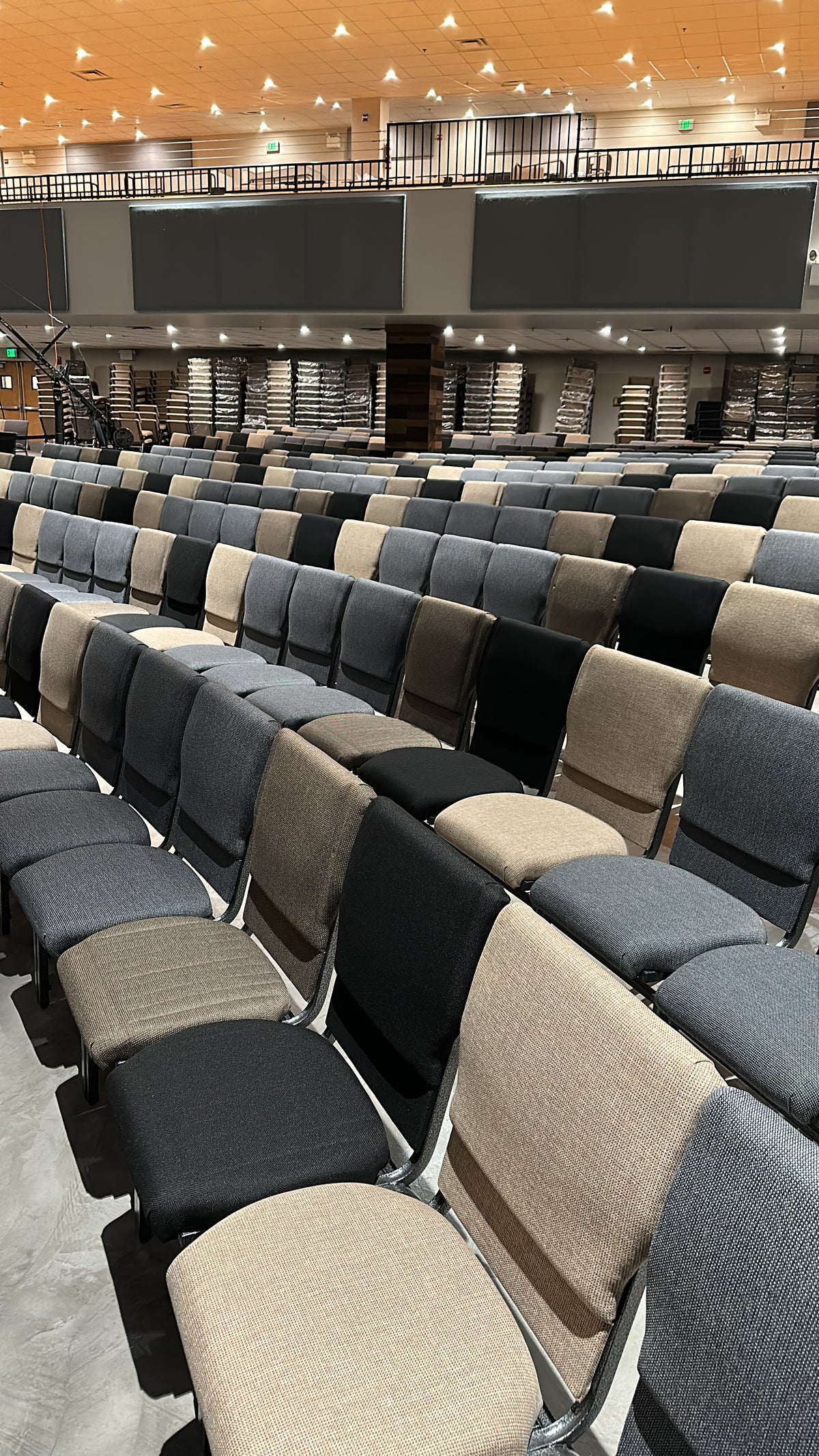 Upholstered church chairs arranged in sanctuary rows